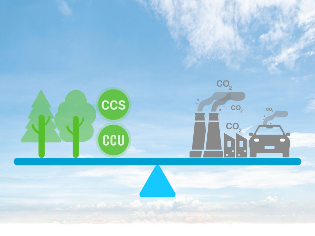 Illustration of a balanced seesaw with trees representing carbon sequestration on one side and, on the other end, cars and factory smokestacks representing carbon emissions