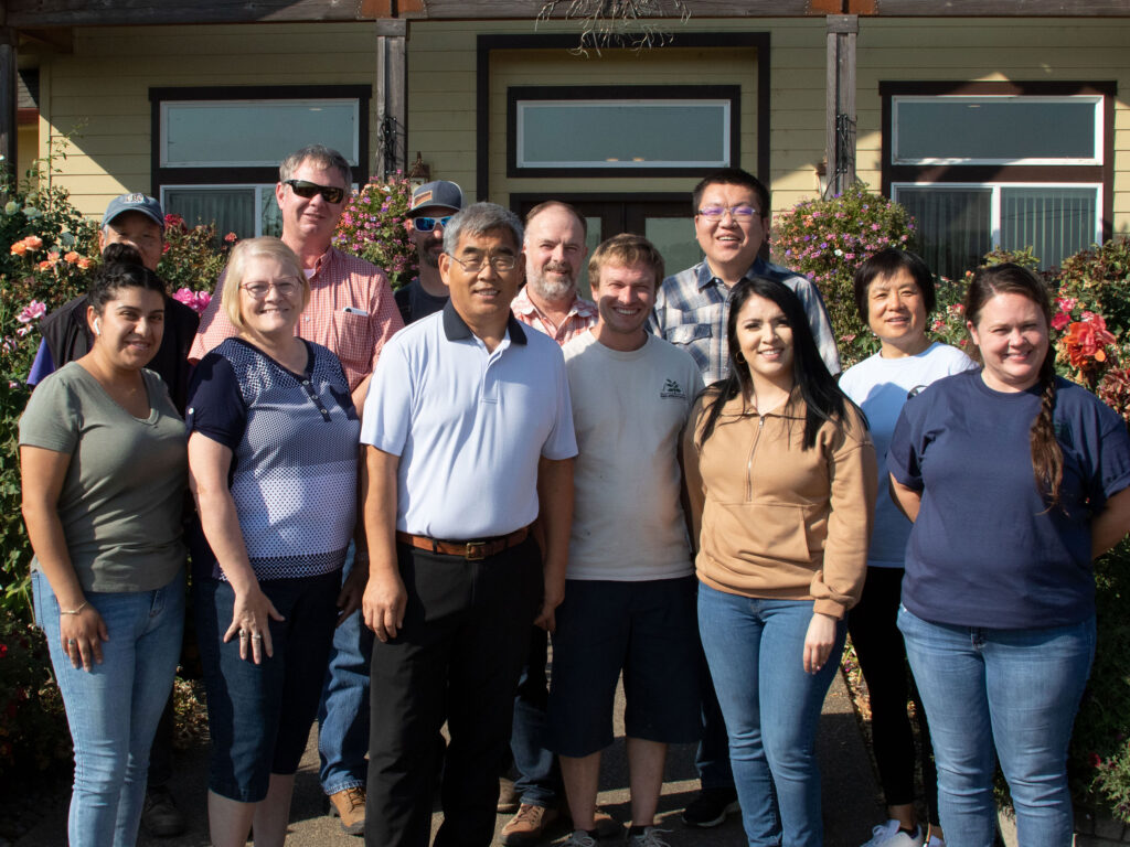 Key employees at North American Plants Inc. include (back row, l-r) Shufu Dong, Clayton Moore Jr., Jeremy Dewar, Michael Remmick, William Wang, Calxia Li, (front row, l-r) Ella Olague, Jan Young, Yongjian Chang, Nhicolas Michels, Georgina Madrigal and Emily Steadman. Photo by Curt Kipp