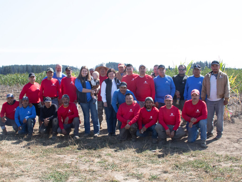 The Motz & Son Nursery crew. Standing from left to right: Frank, Silvino, Samuel, Carlos, Anne Marie Boyd, Daniel, Isidro, Armando, Nancy Richards, Simon, Jose V., Salvador, Edgar, Jose Juan, Antonio, Jorge, Juan C., Felipe and Higinio. Kneeling from left to right: Juan Jesus, Martin, Napoleon, Oniver, Gustavo, Anatolio, Agustin and Arturo. Photo by Curt Kipp